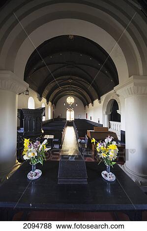 Flowers on a table at the altar of a church; northumberland, england View Large Photo Image Stock Photo - Flowers on a table at the altar of a church; northumberland, england. Fotosearch