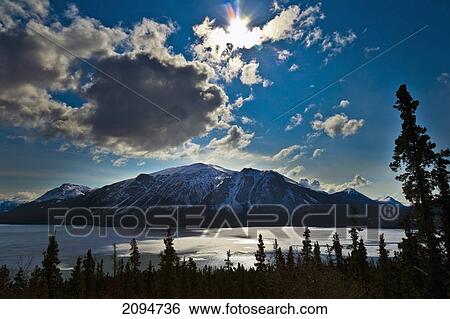 Frozen tagish lake and mountains; carcross, yukon, canada View Large Photo Image Stock Photograph - Frozen tagish lake and mountains; carcross, yukon, canada. Fotosearch