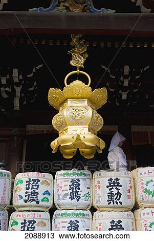 Golden japanese lantern hanging in front of a temple; kyoto, japan View Large Photo Image Stock Image - Golden japanese lantern hanging in front of a temple; kyoto, japan. Fotosearch