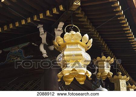 Golden japanese lanterns hanging from a temple roof; kyoto, japan View Large Photo Image Stock Image - Golden japanese lanterns hanging from a temple roof; kyoto, japan. Fotosearch