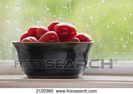 Grape tomatoes in a bowl on a window ledge on a rainy day; calgary alberta canada View Large Photo Image Stock Image - Grape tomatoes in a bowl on a window ledge on a rainy day; calgary alberta canada. Fotosearch