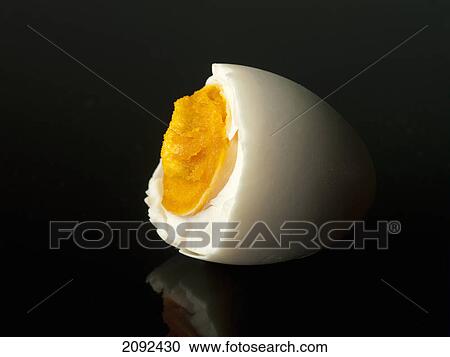 Half of a boiled egg on a black background View Large Photo Image Stock Image - Half of a boiled egg on a black background. Fotosearch