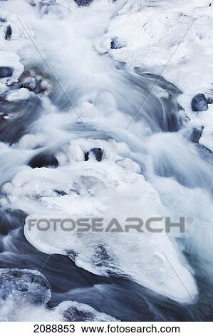 Stock Image - Ice covered creek in columbia river gorge national scenic area; oregon, united states of america. Fotosearch