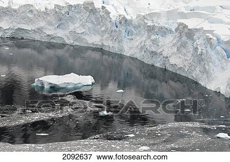 Iceberg floating along the coastline; antarctica View Large Photo Image Stock Photo - Iceberg floating along the coastline; antarctica. Fotosearch