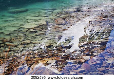 Stock Photography - Lake louise in alberta's rocky mountain range; lake louise, alberta, canada. Fotosearch