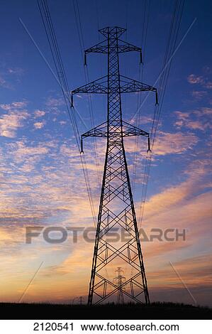 Large metal electric tower at sunrise with dramatic colourful clouds and blue sky; calgary alberta canada View Large Photo Image Stock Image - Large metal electric tower at sunrise with dramatic colourful clouds and blue sky; calgary alberta canada. Fotosearch