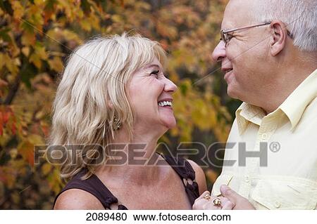 Mature married couple spending time together in a park in autumn; edmonton, alberta, canada View Large Photo Image Stock Image - Mature married couple spending time together in a park in autumn; edmonton, alberta, canada. Fotosearch