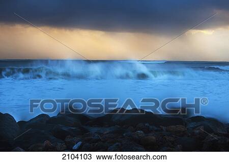 Mist above the splashing waves along the coast at sunset; kirra gold coast queensland australia View Large Photo Image Stock Image - Mist above the splashing waves along the coast at sunset; kirra gold coast queensland australia. Fotosearch