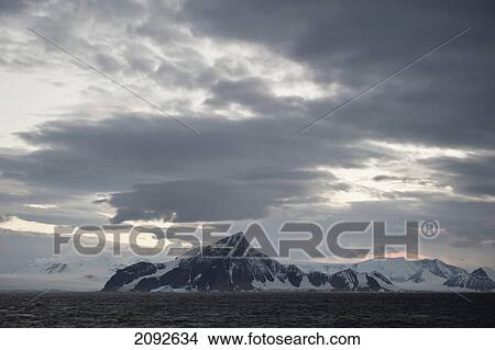 Picture - Mountains along the coastline; antarctica. Fotosearch