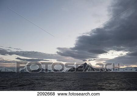 Stock Photo - Mountains along the coastline; antarctica. Fotosearch