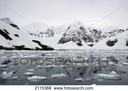 Mountains and glaciers reflected in the water; antarctica View Large Photo Image Stock Photo - Mountains and glaciers reflected in the water; antarctica. Fotosearch
