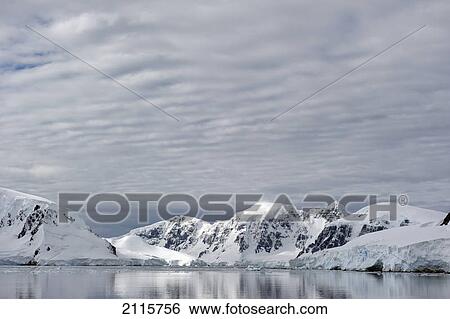 Mountains reflected in the water; antarctica View Large Photo Image Stock Photograph - Mountains reflected in the water; antarctica. Fotosearch