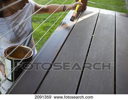 Painting a wooden surface; dunsborough, west australia, australia View Large Photo Image Stock Photo - Painting a wooden surface; dunsborough, west australia, australia. Fotosearch