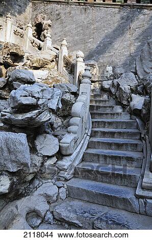 Picture - Pile of rocks beside steps and a railing; beijing china. Fotosearch