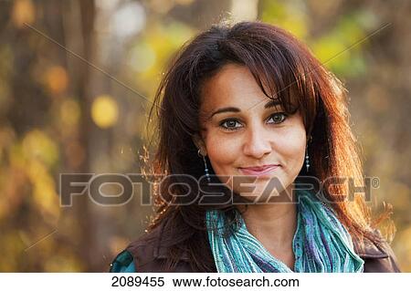 Portrait of a woman in a park in autumn; edmonton, alberta, canada View Large Photo Image Stock Photography - Portrait of a woman in a park in autumn; edmonton, alberta, canada. Fotosearch