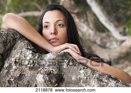 Portrait of a woman on a tree branch; gold coast queensland australia View Large Photo Image Stock Photo - Portrait of a woman on a tree branch; gold coast queensland australia. Fotosearch