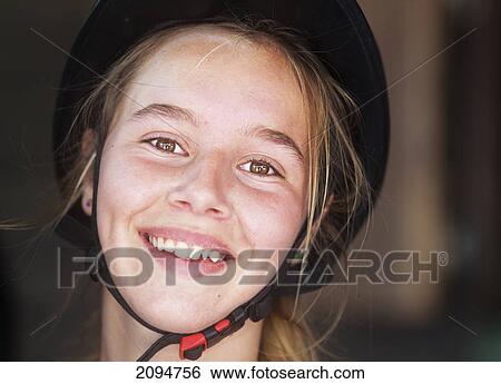 Portrait of a young woman equestrian wearing a black helmet; mijas, malaga, andalusia, spain View Large Photo Image Stock Photograph - Portrait of a young woman equestrian wearing a black helmet; mijas, malaga, andalusia, spain. Fotosearch