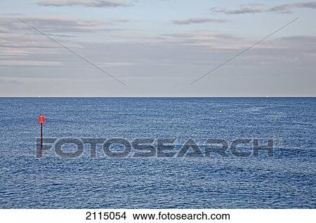 Picture - Red marker in the english channel; sidmouth devon england. Fotosearch