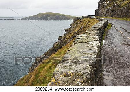 Picture - Road along the coast; ireland. Fotosearch