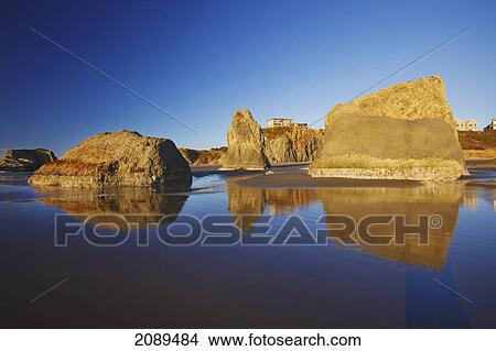 Picture - Rock formations at low tide on bandon beach; oregon, united states of america. Fotosearch