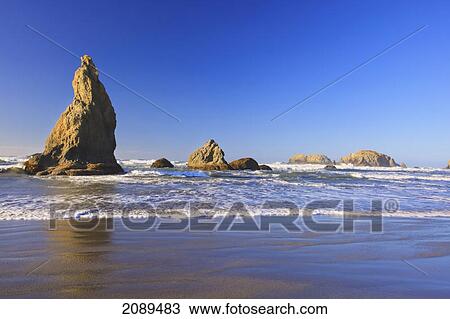 Stock Image - Rock formations at low tide on bandon beach; oregon, united states of america. Fotosearch
