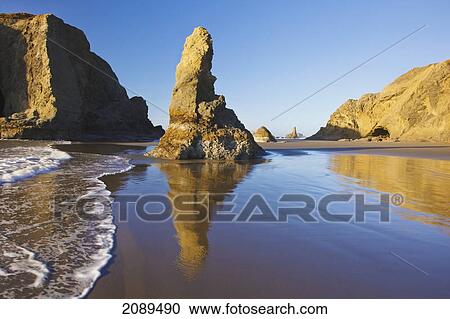Rock formations at low tide on bandon beach; oregon, united states of america View Large Photo Image Stock Image - Rock formations at low tide on bandon beach; oregon, united states of america. Fotosearch