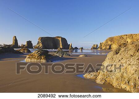 Stock Image - Rock formations at low tide on bandon beach; oregon, united states of america. Fotosearch