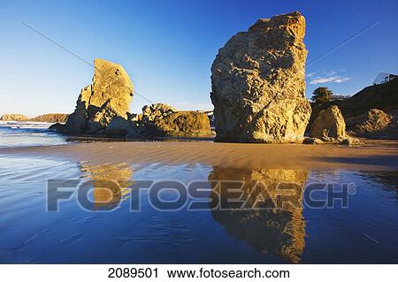 Stock Image - Rock formations at low tide on bandon beach; oregon, united states of america. Fotosearch