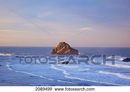 Stock Photo - Rock formations at low tide on bandon beach at sunset; oregon, united states of america. Fotosearch