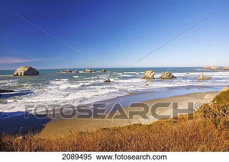 Rock formations at low tide on bandon beach; oregon, united states of america View Large Photo Image Stock Photography - Rock formations at low tide on bandon beach; oregon, united states of america. Fotosearch
