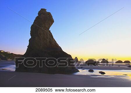 Rock formations at low tide on bandon beach at sunset; oregon, united states of america View Large Photo Image Stock Photography - Rock formations at low tide on bandon beach at sunset; oregon, united states of america. Fotosearch