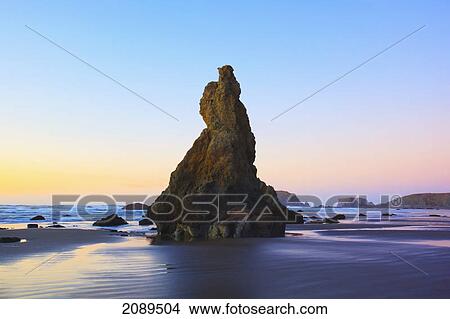 Rock formations reflecting in tide pools at low tide on bandon beach at sunset; oregon, united states of america View Large Photo Image Picture - Rock formations reflecting in tide pools at low tide on bandon beach at sunset; oregon, united states of america. Fotosearch