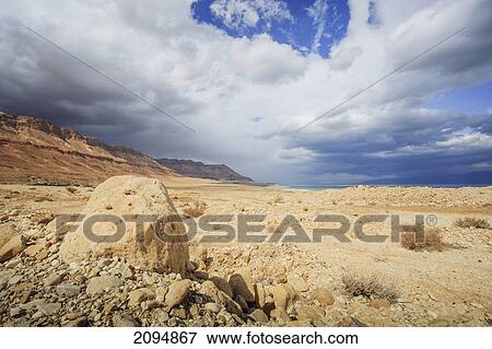 Rocks on an arid landscape; jordan valley israel View Large Photo Image Stock Photo - Rocks on an arid landscape; jordan valley israel. Fotosearch