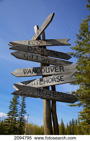 Stock Photography - Rustic canadian wooden destination sign post; stewart crossing, yukon, canada. Fotosearch
