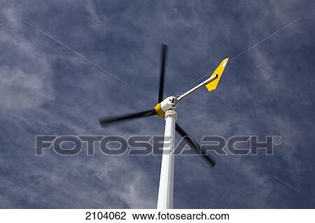 Small windmill against a blue sky and clouds; alberta canada View Large Photo Image Stock Image - Small windmill against a blue sky and clouds; alberta canada. Fotosearch