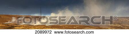 Stock Image - Smoke billowing up from a landscape; durham, england. Fotosearch