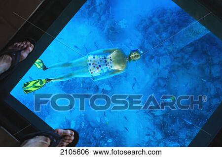 Snorkeler Under The Glass Floor In A Room Of Bora Bora Nui Resort