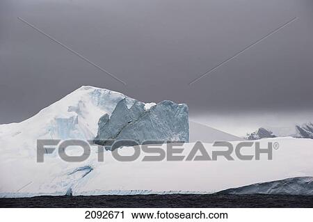 Snow covered mountains along the coastline; antarctica View Large Photo Image Stock Image - Snow covered mountains along the coastline; antarctica. Fotosearch