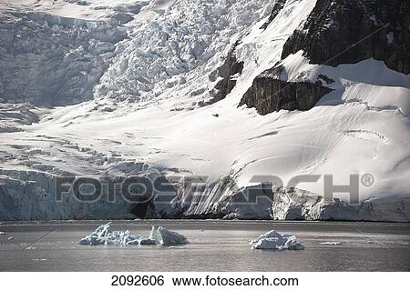 Snow, icebergs and glaciers along the coastline; antarctica View Large Photo Image Stock Photograph - Snow, icebergs and glaciers along the coastline; antarctica. Fotosearch