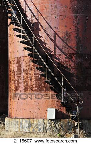 Stock Photo - Steps up the side of a round red metal structure; beijing china. Fotosearch