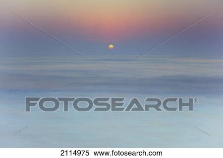 Sun rising over blurred water; spain View Large Photo Image Stock Photography - Sun rising over blurred water; spain. Fotosearch