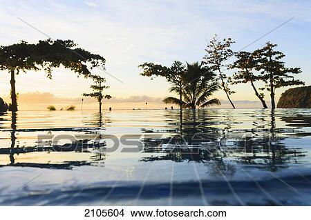 Picture - Sunset at the radisson tahiti resort arue near papeete; tahiti nui french polynesia south pacific. Fotosearch