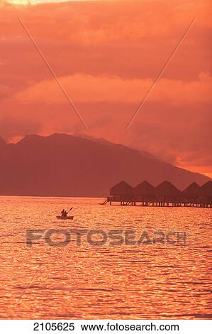 Stock Photography - Sunset over moorea from sofitel maeva beach resort near papeete; tahiti nui society islands french polynesia south pacific. Fotosearch