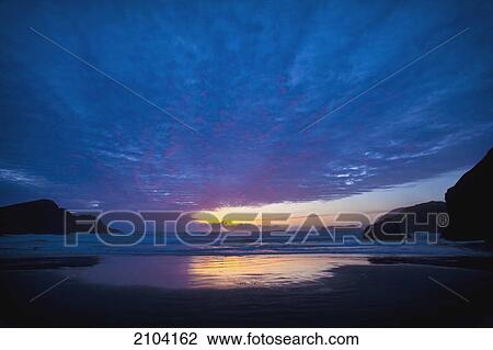 Stock Image - Sunset over the ocean; gold coast oregon united states of america. Fotosearch