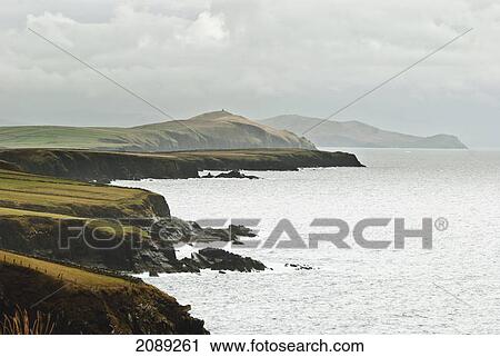 The coastline and cloudy sky; ireland View Large Photo Image Stock Image - The coastline and cloudy sky; ireland. Fotosearch