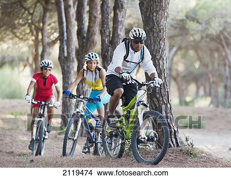 Three adult cyclists on a path; tarifa cadiz andalusia spain View Large Photo Image Picture - Three adult cyclists on a path; tarifa cadiz andalusia spain. Fotosearch