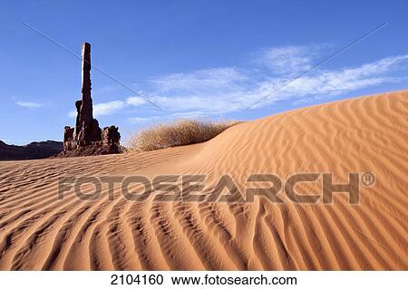 Totem pole at monument valley with sand dunes; arizona united states of america View Large Photo Image Stock Image - Totem pole at monument valley with sand dunes; arizona united states of america. Fotosearch