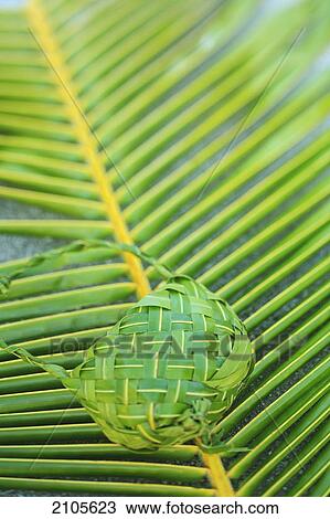 Traditional hand woven palm frond purse; fakarava island tuamotus group french polynesia south pacific View Large Photo Image Stock Image - Traditional hand woven palm frond purse; fakarava island tuamotus group french polynesia south pacific. Fotosearch