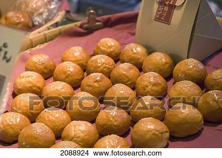 Tray of japanese buns in a street market; kyoto, japan View Large Photo Image Picture - Tray of japanese buns in a street market; kyoto, japan. Fotosearch