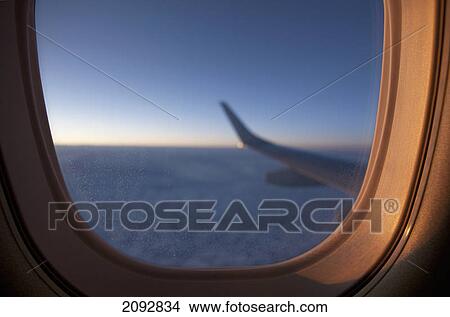 View from cabin of embraer 190 aircraft at sunset; manitoba, canada View Large Photo Image Picture - View from cabin of embraer 190 aircraft at sunset; manitoba, canada. Fotosearch